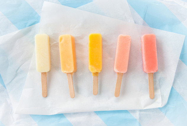 Homemade vanilla and strawberry ice cream popsicles